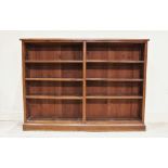 A Victorian stained pine open front bookcase, with an arrangement of six adjustable shelves, upon