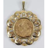 An Edwardian sovereign, marks for 1906, set to a pierced 9ct gold pendant mount, 38mm diameter,