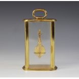 A Jaeger-Le Coultre mystery timepiece, the lacquered brass case with glazed convex front and side