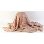 An Art Deco machine woven table cloth woven in tones of pink and cream, the central rectangular