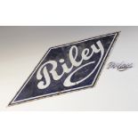 A vintage enamelled metal sign for 'Riley', mid 20th century, the lozenge shaped sign with white