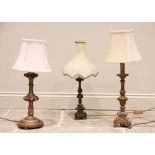 Three gilt wood Rococo style table lamps, 20th century, two of triform with moulded scrolling