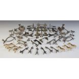 A collection of novelty animal knife rests, including six silver coloured foxes, each 9cm long, a