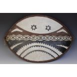 An East African Masai tribal art painted hide shield, 76cm long