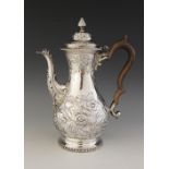 A George III silver coffee pot, Francis Crump, London 1769, of baluster form on circular foot and