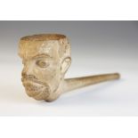 A meerschaum pipe, probably 19th century, the bowl modelled as the head of an African man, 18cm long