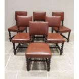 A set of six Victorian 17th century revival oak dining chairs, each chair with a padded back rest