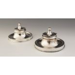 A near pair of Edwardian silver mounted capstan inkwells, William Neale, Birmingham 1907, each