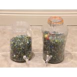 A large collection of glass marbles, 20th century, to a Kilner water dispenser jar and a Perspex