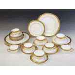 A Minton part service in the 'Buckingham' pattern, comprising: eight dinner plates, seven desert