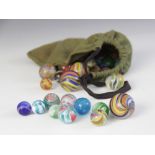 A quantity of marbles of various sizes, Victorian and later, to a woven bag (Qty)