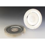 A set of twelve Eastern white metal coloured platters/plate stands, each of circular form with