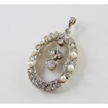 A Belle Epoque diamond and pearl set pendant, the oval openwork frame set with eight cut diamonds