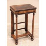 A Williams IV rosewood work table, the rectangular top above a front cushion frieze drawer and a