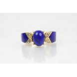 A lapis lazuli and diamond set dress ring, designed as a central polished oval lapis lazuli cabochon