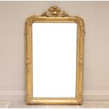 A Louis XVI style giltwood and gesso wall mirror, 19th century, the frame surmounted with an open