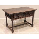 An 18th century and later oak and walnut Spanish side table, the rectangular slab top over two