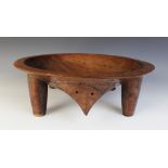 A large Oceanic/Polynesian Fijian Kava bowl, supported by four legs, 42.5cm diameter