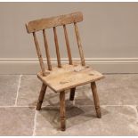 A 19th century ash and sycamore Welsh primitive chair, the stick back above a rectangular sycamore