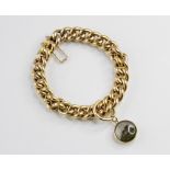 A curb link yellow metal bracelet, tongue and box snap clasp stamped ?18CT?, approx. 20cm long,