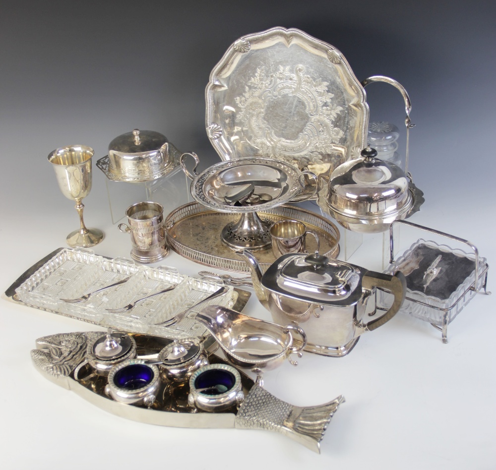 A large collection of silver plated and silver coloured tableware, to include a set of twelve double