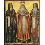 A Greek Orthodox icon, Depicting three saints, Tempera on board, rich gilt ground and polychrome,