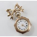 An early 20th century 9ct gold fob watch, the white enamel dial with roman numerals and applied gold