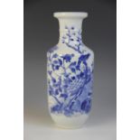 A Chinese porcelain vase, 19th century, of rouleau form and decorated in blue and white with