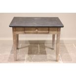 A 19th century slate top oak kitchen table, the rectangular slate slab top with rounded font corners