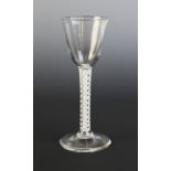 A round funnel bowl cordial glass, the bowl on double series opaque twist stem terminating in a