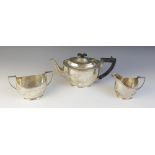 An Edwardian silver tea service, Barker Brothers, Chester 1906, comprising teapot, sucrier and