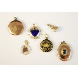 A 19th century gold coloured and enamel mourning pendant, of circular form engraved with initials