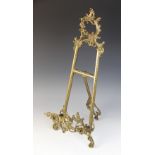 A 19th century cast brass easel in the Rococo manner, 55cm high