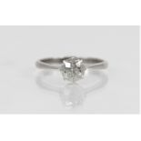 A diamond solitaire ring, the central round old cut diamond weighing approximately 0.75 - 0.80