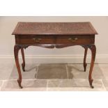 An early 20th century mahogany side table, the rectangular moulded top applied with trailing foliate
