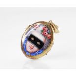 A Victorian yellow enamelled locket pendant, the cover with an enamelled portrait of a masked