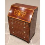 An Edwardian mahogany and satinwood cross banded Sheraton revival bureau, the fall font inlaid