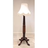A 19th century style mahogany standard lamp, early 20th century, the wrythen and vertically lobed