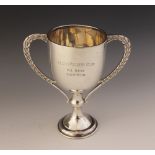A silver coloured twin-handled trophy cup, marks for James Walter Tiptaft, the plain polished bowl