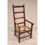 A West Country oak and ash ladder back armchair, late 19th century, of large proportions, the angled