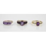 An amethyst and diamond 14ct gold ring, the central octagonal step cut amethyst measuring 7mm x 5mm,