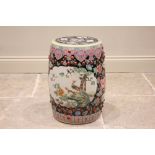 A Chinese porcelain famille noir opium stool, early 20th century (Republic Period), the barrel