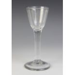 A heavy gauge ogee bowl wine or cordial glass, on plain stem terminating in conical foot, unground