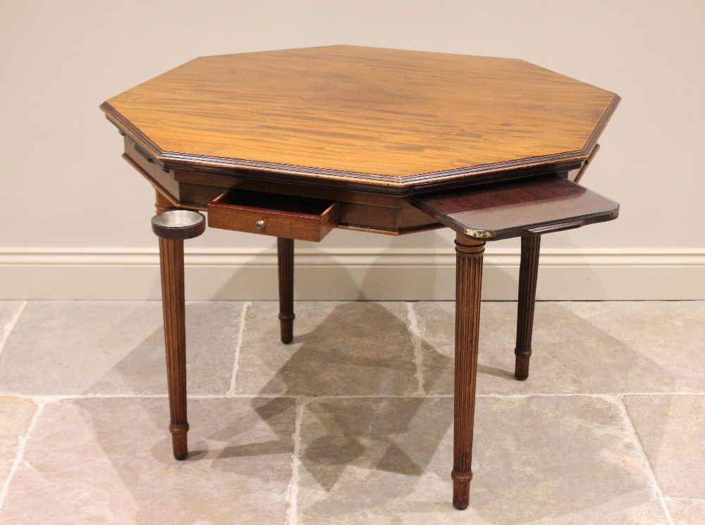 An early 20th century octagonal mahogany bridge table, by Trollope and Colls, London, with a - Bild 2 aus 4