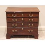 A George III mahogany bachelors chest, the rectangular moulded top above a brushing slide and four