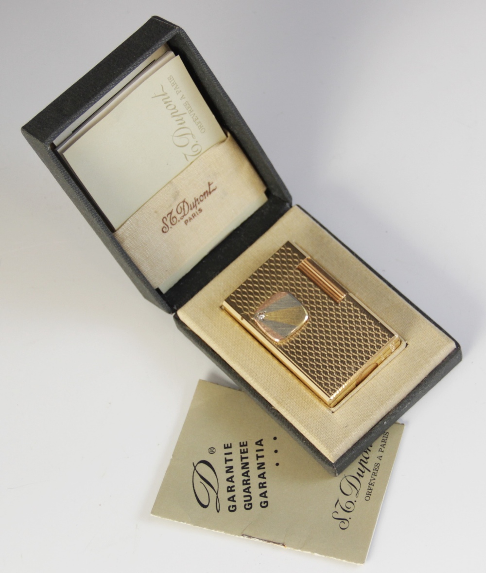 A Dupont diamond set gold plated lighter, of rectangular form with engine turned decoration, applied - Image 3 of 5