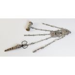 A Victorian silver plated chatelaine, the scrolling mount with five graduated chains, maximum length