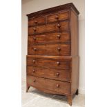 A George III mahogany chest on chest, the moulded pediment above two short and three long oak