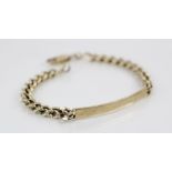 A 9ct gold identity bracelet, comprising a plain polished rectangular tag upon a curb link chain