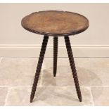 A George III mahogany gypsy table, the circular table top with a reeded edge and moulded rim, raised